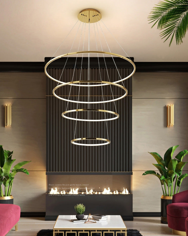 Four horizontally aligned LED rings above a modern fireplace, creating orderly architectural rhythm and calm ambient light.