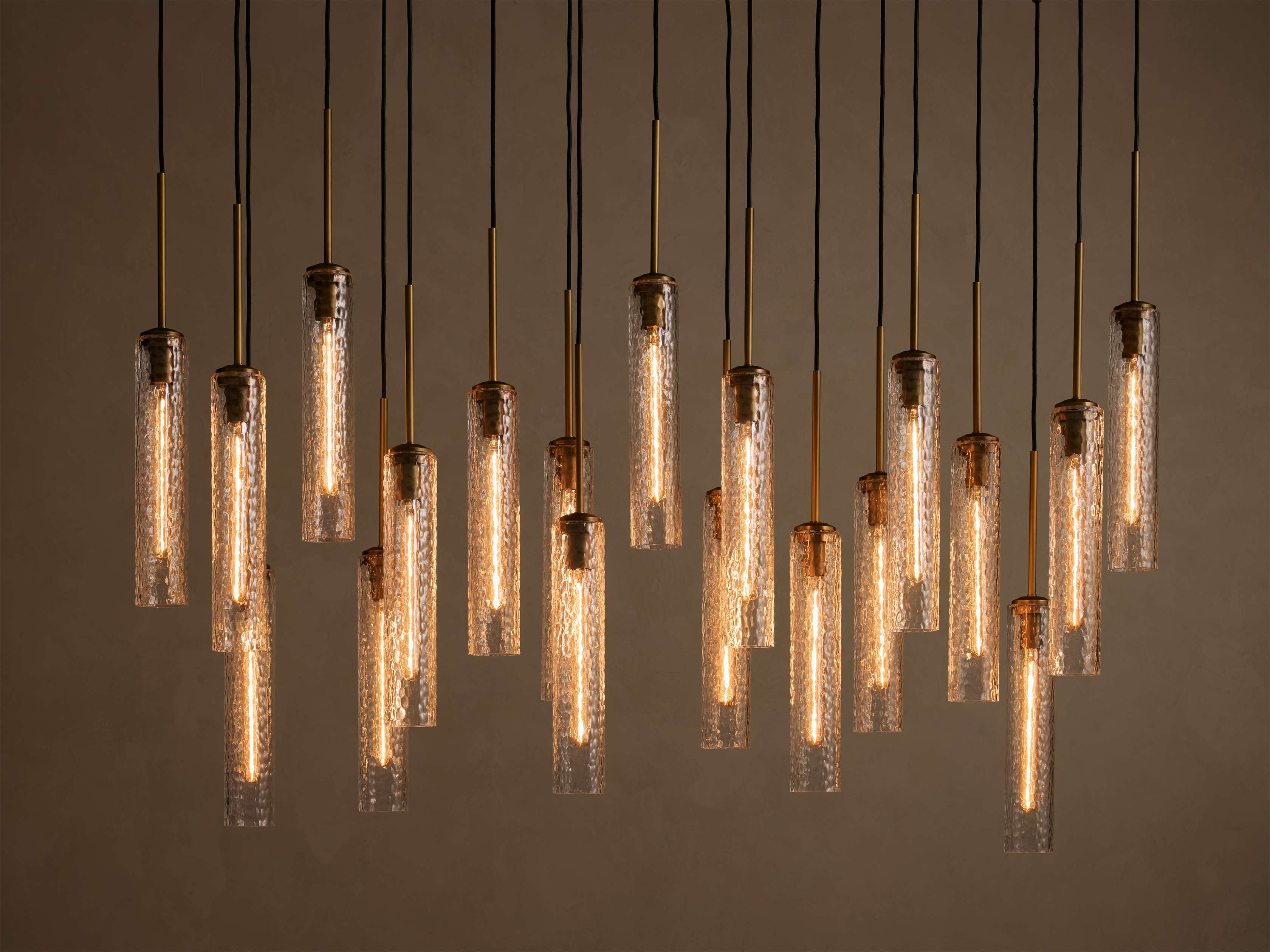 Colleena 64" Linear Chandelier with Hammered Glass in Brass (1 of 4)
