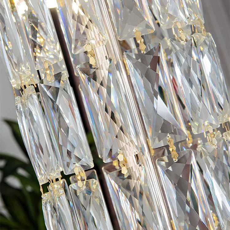 Chandelier crystal pieces reflecting warm light