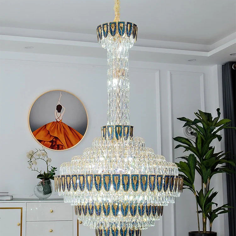 Luxury chandelier installation in high-ceiling entrance area