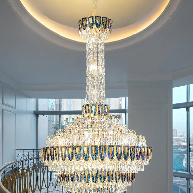 Luxury crystal chandelier hanging in a double-height staircase space
