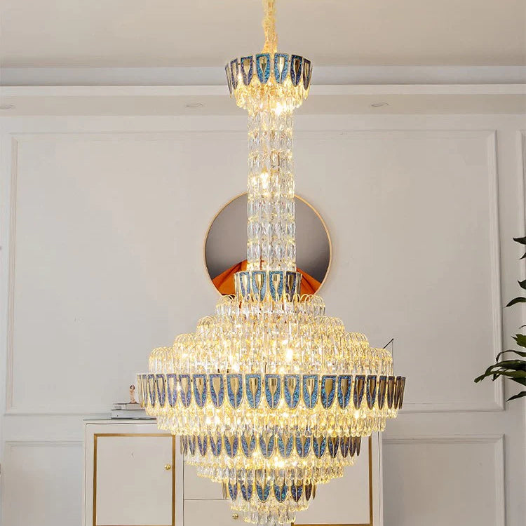 Elegant foyer space with oversized crystal chandelier centerpiece