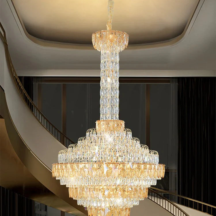 Luxury chandelier installation in high-ceiling entrance area