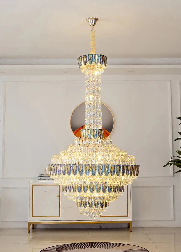 Elegant foyer space with oversized crystal chandelier centerpiece