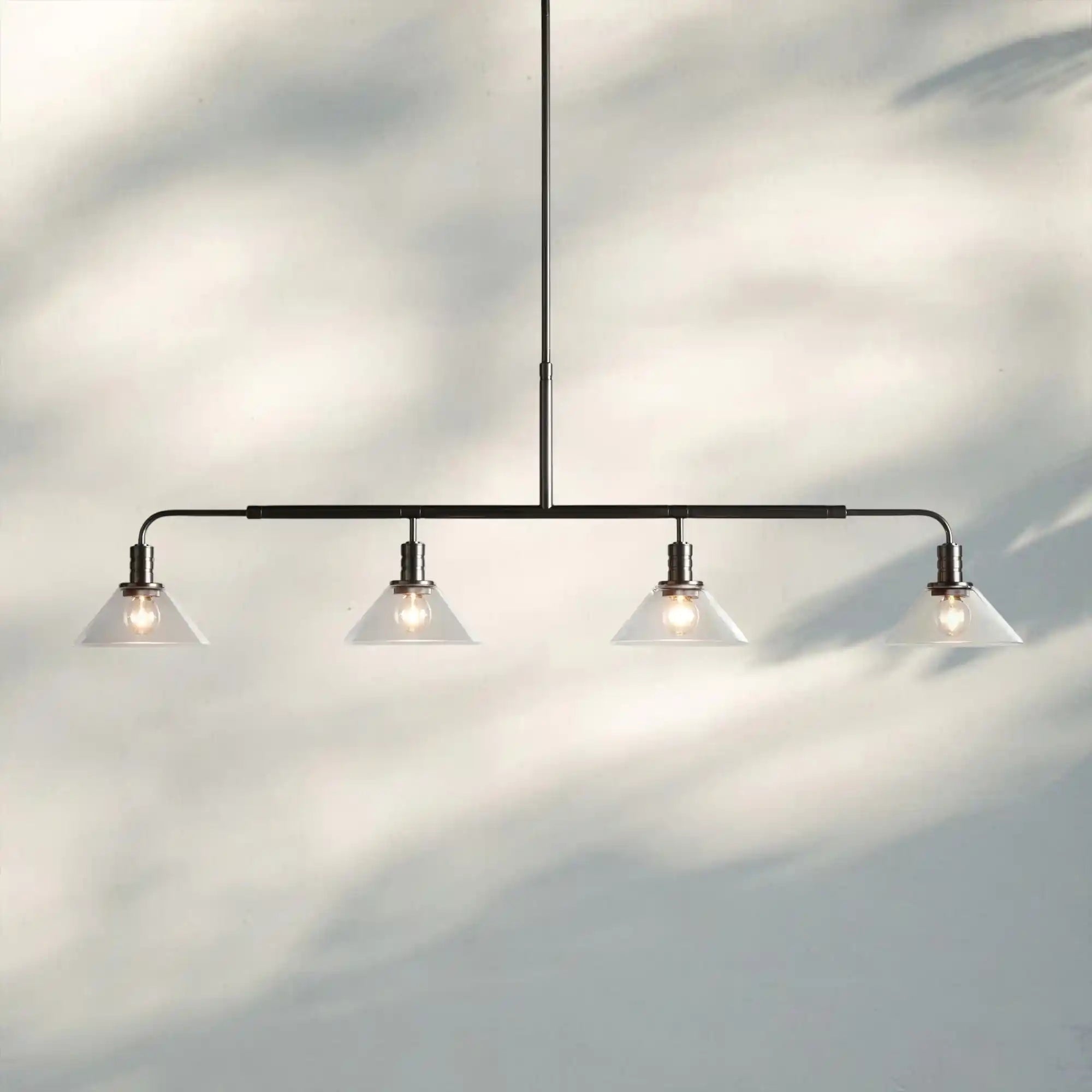 Theron Glass Linear Chandelier - 50"ClearBronzeBlushlighting