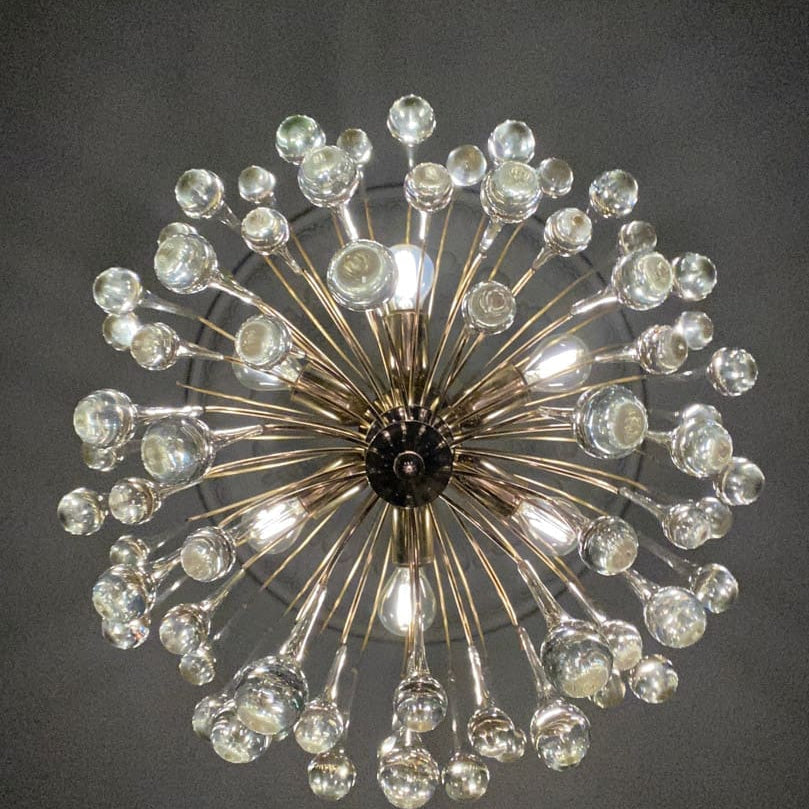 Decorative chandelier with crystal-like beads on a dark background