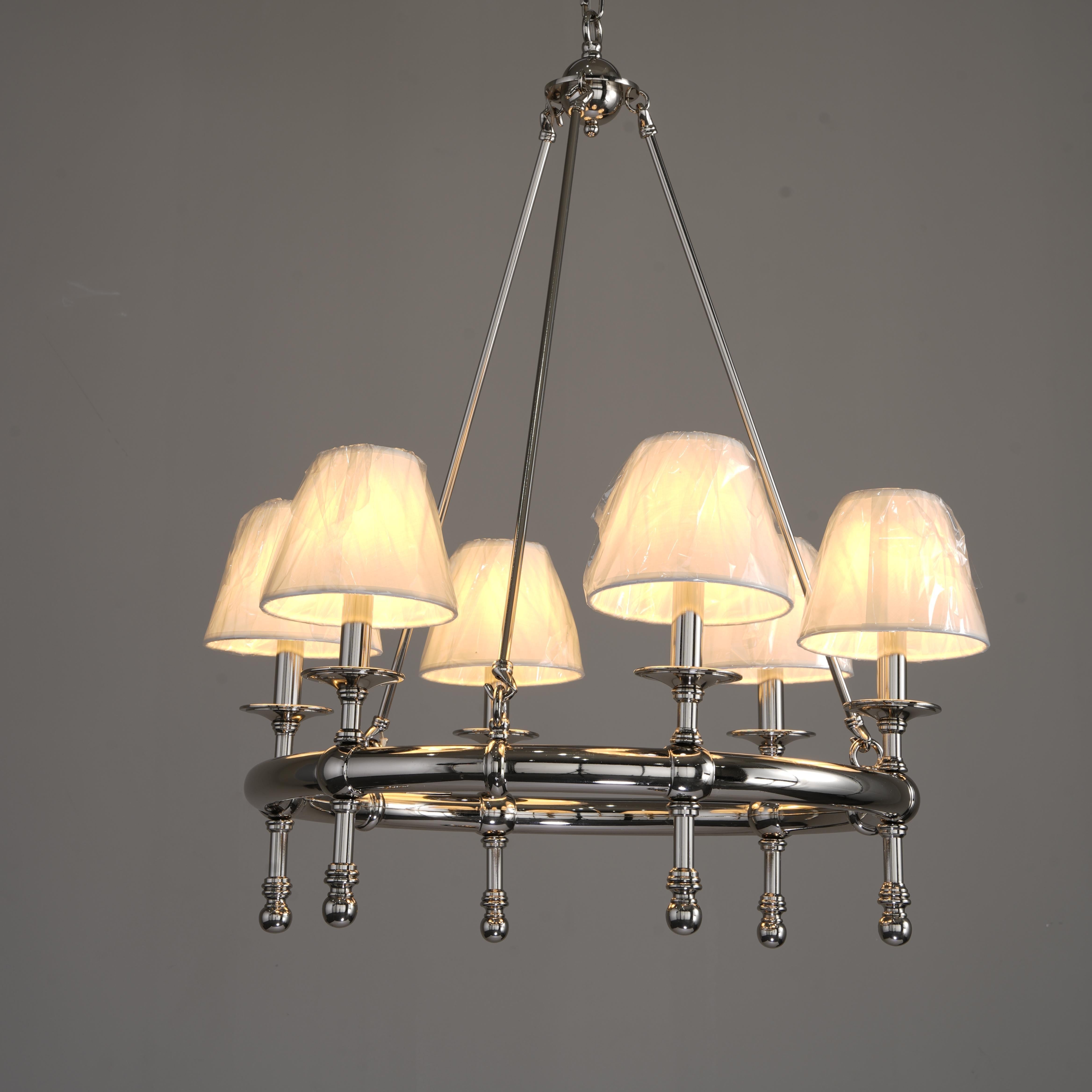 Chandelier with six lampshades on a gray background