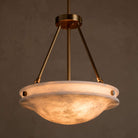 Front view of the Edith Pendant with a brass finish and a glowing, marbled alabaster stone shade.