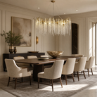 A Blush gold metal branch chandelier with cascading crystal beads suspended in a rainfall arrangement.