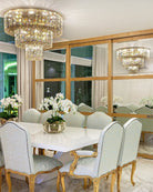 Dining room with a chandelier, table, and chairs.