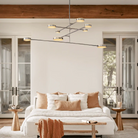 Soft ambient glow from the Alexander Mobile Chandelier 60" in a relaxing bedroom setting