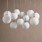 Casen Modern Round Chandelier - Hand-Blown Crackle Glass & Satin Brass LED Pendant Light - 7-Light 34''Matte OpalBlushlighting