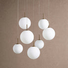 Casen Modern Round Chandelier - Hand-Blown Crackle Glass & Satin Brass LED Pendant Light - 7-Light 34''Matte OpalBlushlighting
