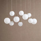 Casens Modern Linear Chandelier - Hand-Blown Glass Globe Pendant Light for Dining Table & Kitchen Island - 55" 10-LightMatte OpalBlushlighting