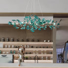 Modern green ginkgo chandelier with leaf-like design for kitchen counter.