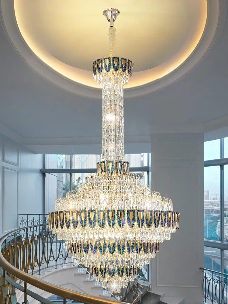 Luxury crystal chandelier hanging in a double-height staircase space