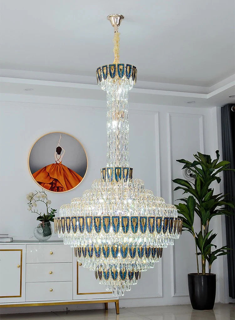 Luxury chandelier installation in high-ceiling entrance area