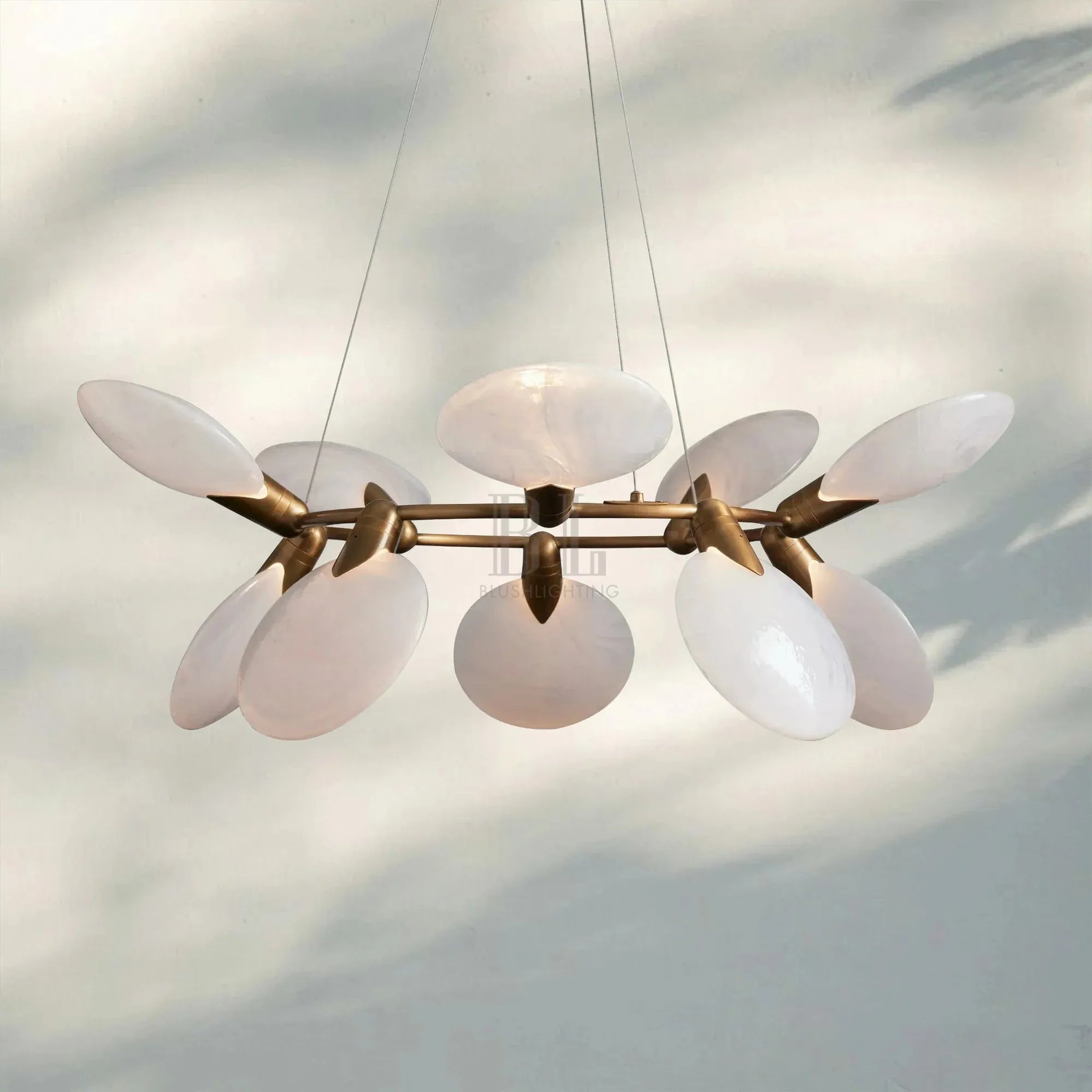 Close-up of Lyla Halo Chandelier with alabaster ring and warm LED glow