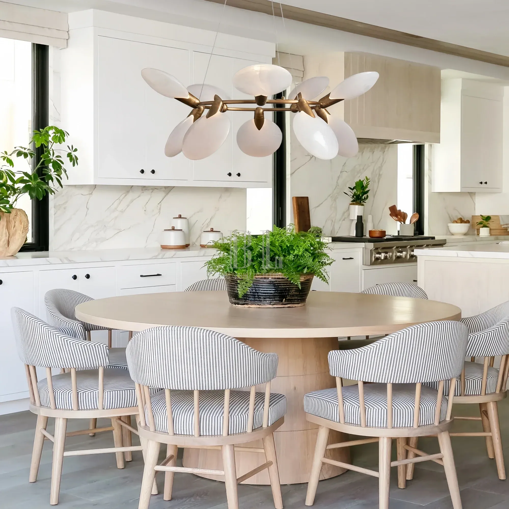 Dining room illuminated by Lyla Halo Chandelier with elegant circular design