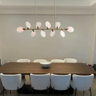 Modern living space illuminated by Lyla Linear Chandelier in linear design