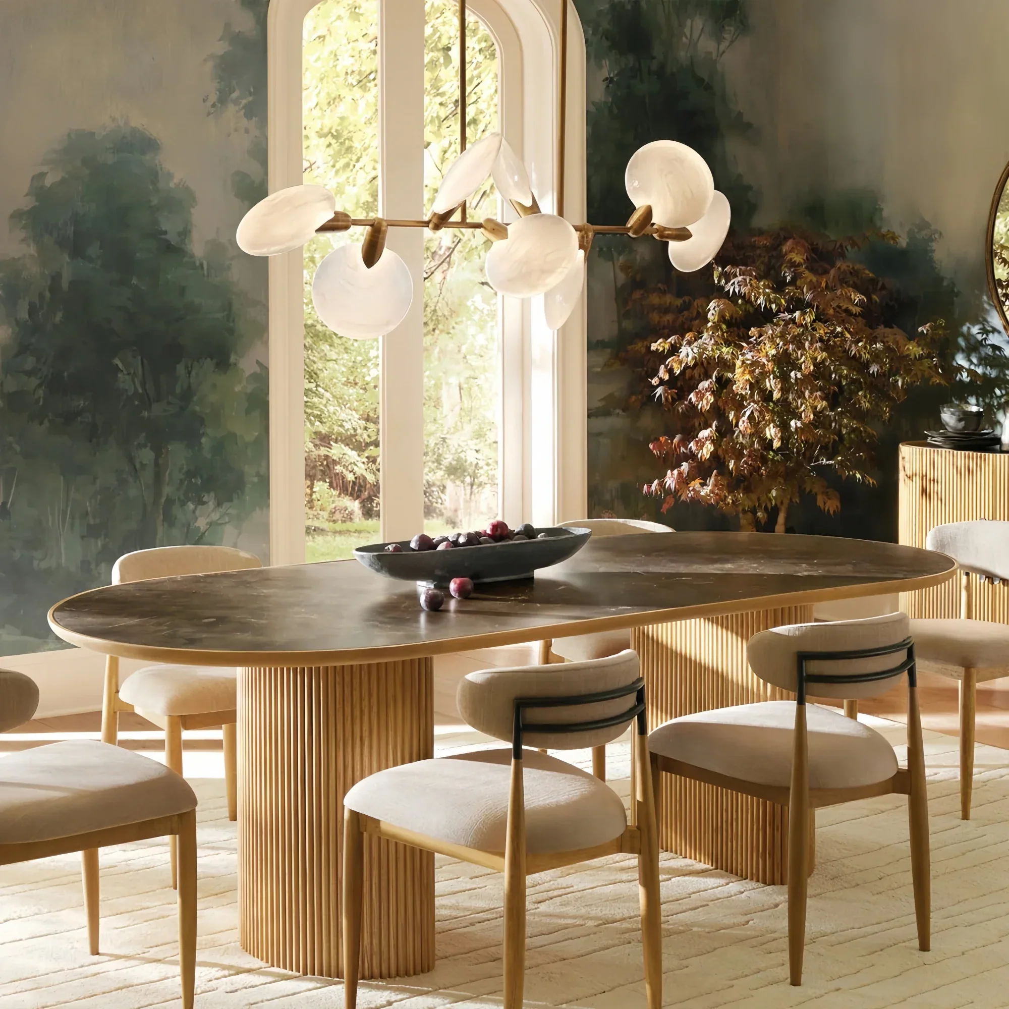 Lyla round chandelier hanging above dining table