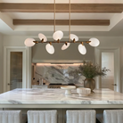 Elegant dining room with Lyla Linear Chandelier providing soft warm light