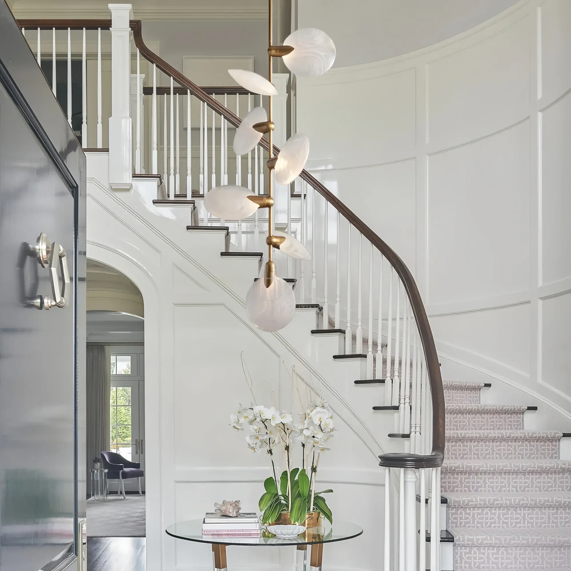 Lyla Pendant chandelier hanging in staircase with modern alabaster design