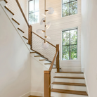 Modern staircase pendant lighting featuring Lyla Pendant in brushed brass