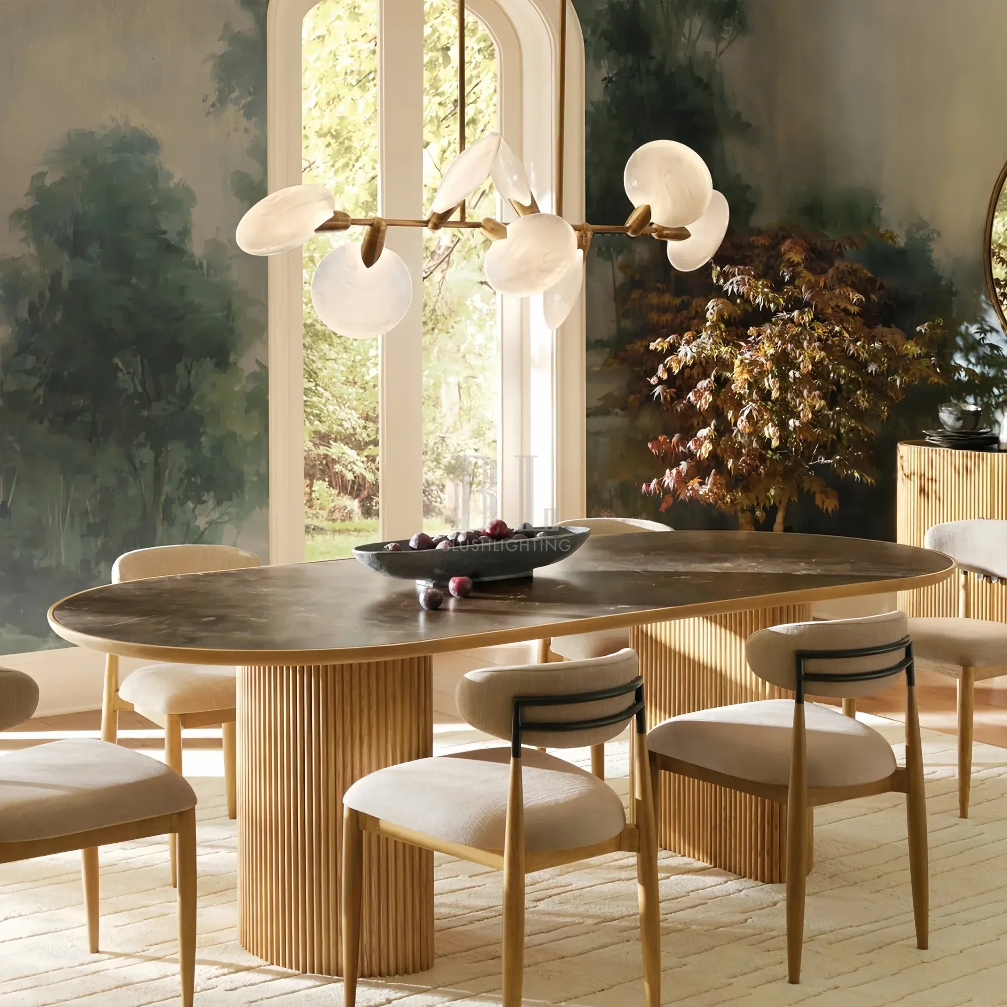 Lyla round chandelier hanging above dining table