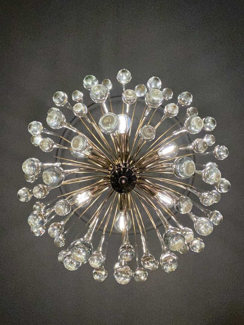 Decorative chandelier with crystal-like beads on a dark background