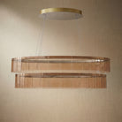 Yiosi Astor 59 inch oval handmade glass linear chandelier with antique brass finish — modern dining pendant